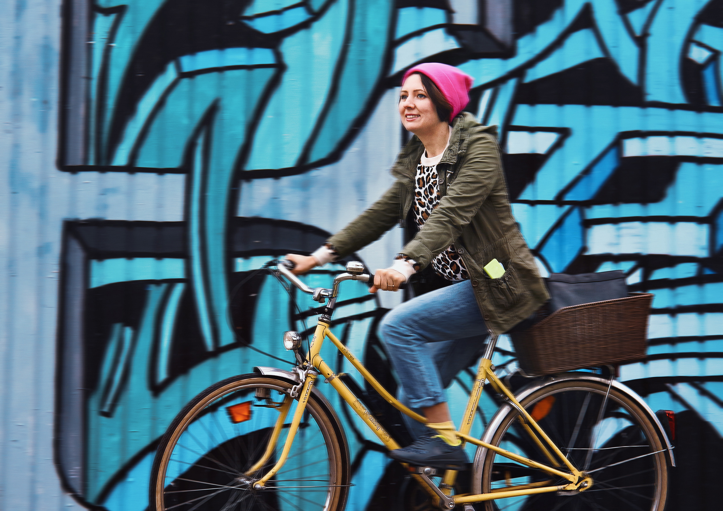 A young woman rides a yellow bike in an urban environment. Anna Maysuk, Bike, Velo, Zurich, Zürich